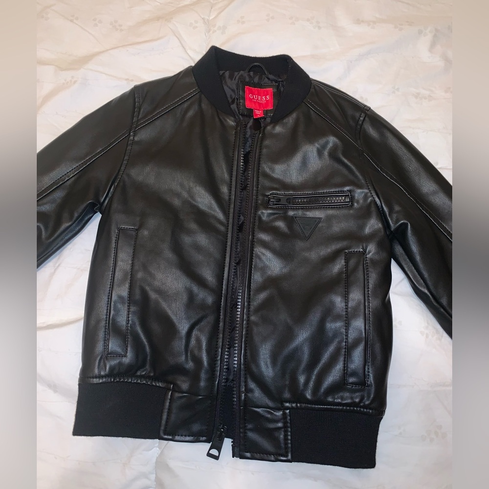 Boys black faux leather bomber style jacket by Guess in size 5. New condition